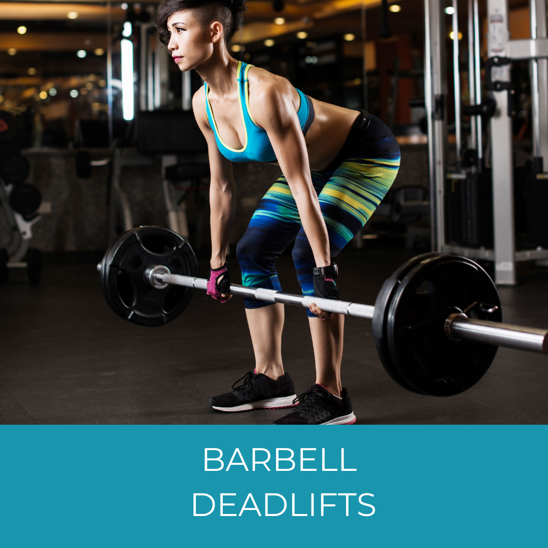 woman doing barbell deadlifts in a gym