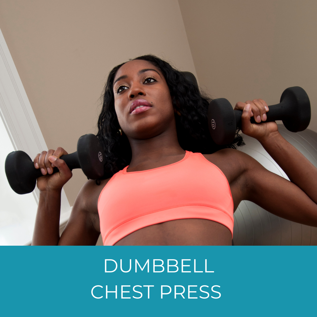 woman doing dumbbell chest presses at home