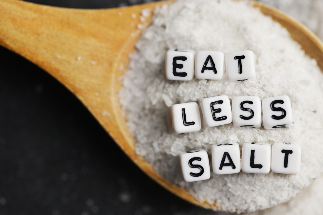 Vegan substitutes - Close-up of salt on a wooden spoon with 