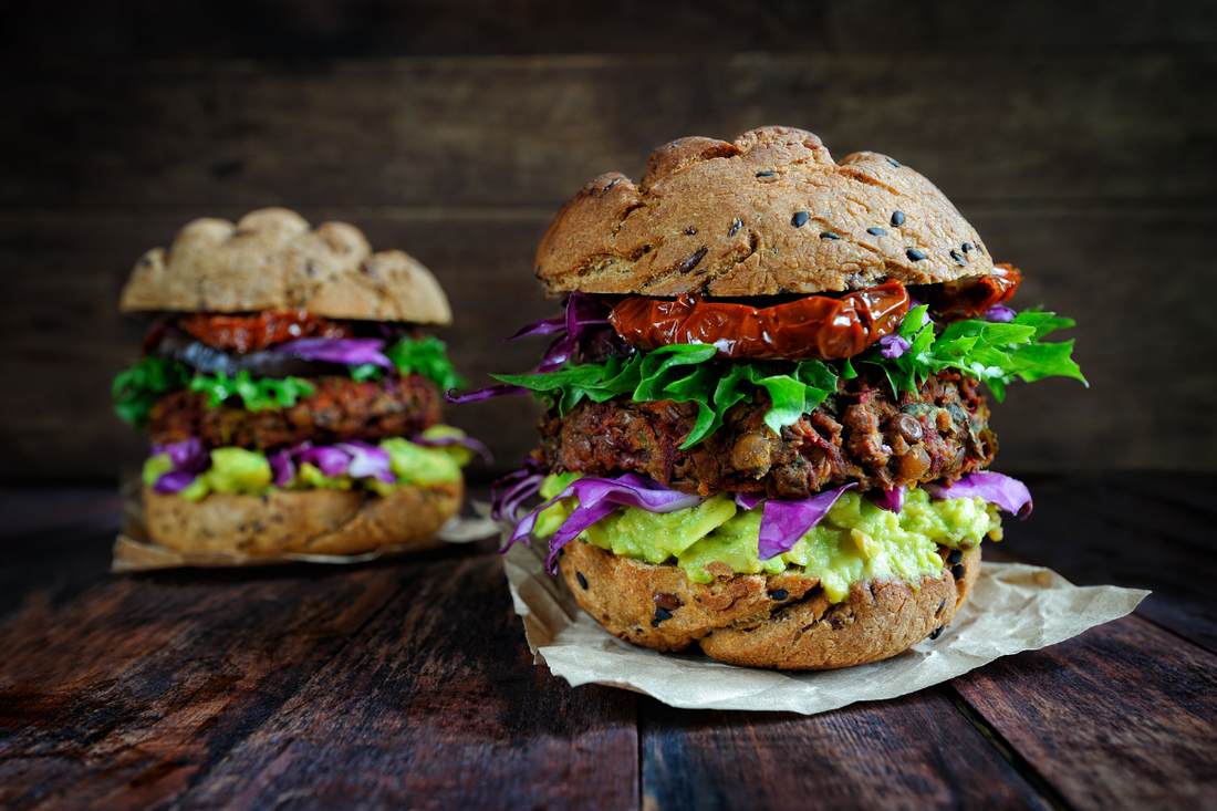 Vegan substitutes - two veggie burgers on a table.